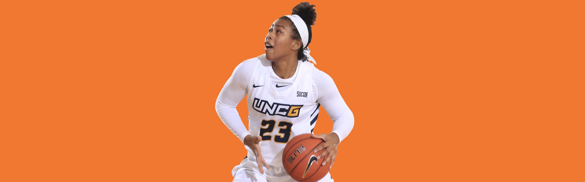 basketball player dunking a ball